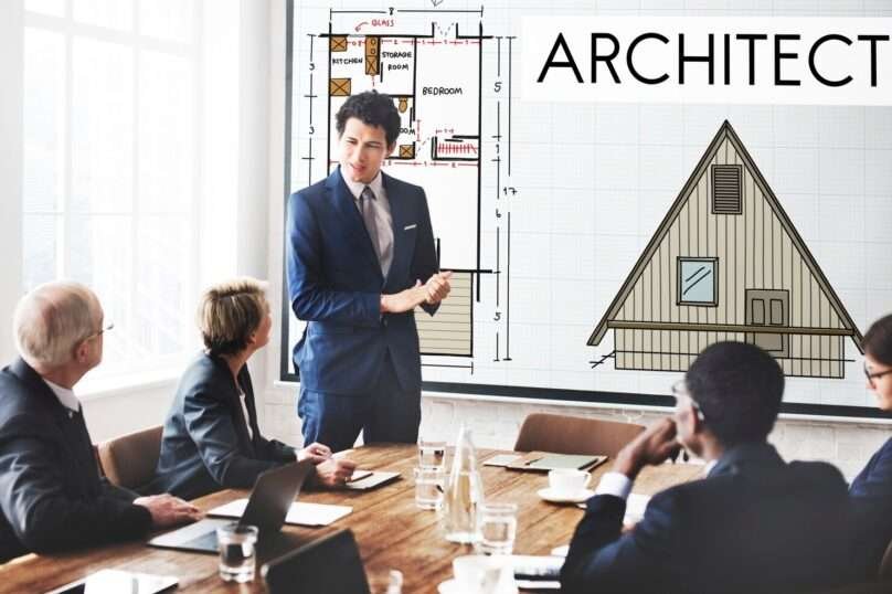 Architect presenting building design plans during a client meeting, illustrating architectural design and planning process — JD Engineers & Consultants.